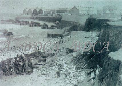 58   groynes damaged shoreline men working